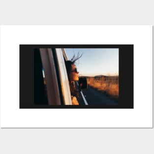 Road Tripping - Beautiful Woman Sticking Head Outside Car Window While Driving Posters and Art